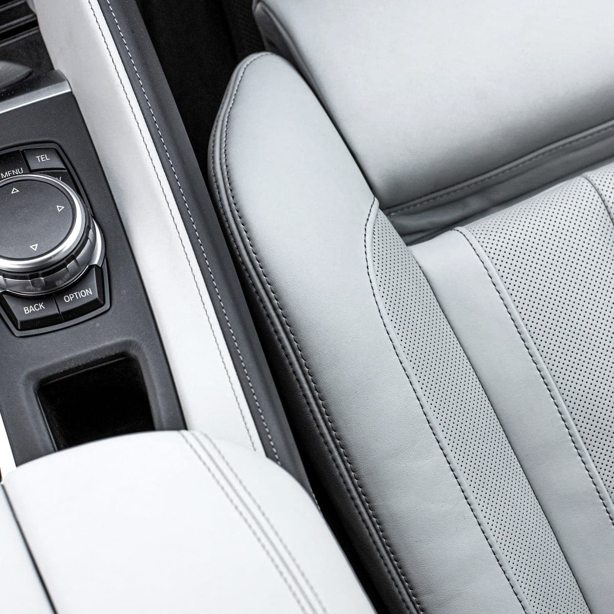 Light leather seat and console cleaned to a matte finish