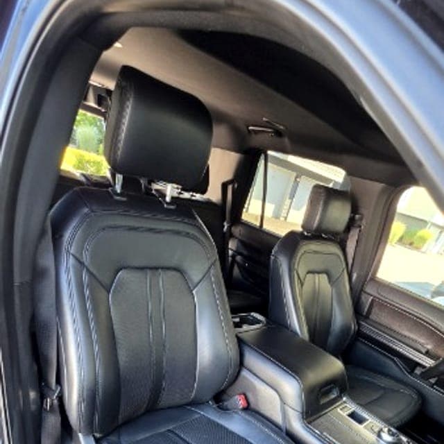 Rear leather seats of a Ford Expedition, cleaned and conditioned